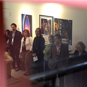 Members of the P4 Summit listen to a presentation at StartUptown,  a community-based coworking campus for technology and social innovation, housed in the Paramount Film Exchange Building in Uptown on Friday.