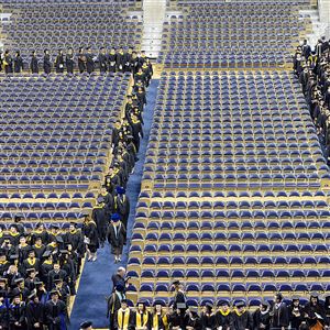 Graduates file into the Peterson Events Center for the 2015 University of Pittsburgh graduation.