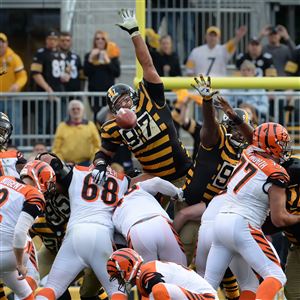 Cincinnati Bengals quarterback Andy Dalton (14) jogs off the field  following the come from behind 16-10 Bengals win against the Pittsburgh  Steelers at Heinz Field in Pittsburgh on November 1, 2015. Photo