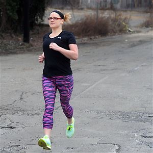 Amy Jacobson of Penn Hills jogs along Madison Avenue on the North Shore on Feb. 21, 2016. 