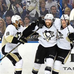 Phil Kessel, middle, celebrates his goal that put the Penguins ahead, 2-0, early in the third period of Game 3 Wednesday night in Tampa, Fla.