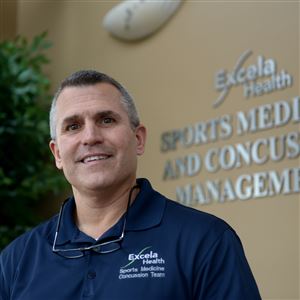 Jim Masterson, director of Excela Health's concussion clinic, in the lobby of his Greensburg office. RightEye, a new screening tool, comes as Excela’s concussion program has been picking up speed, Dr. Masterson said, with a patient increase of 21 percent this year.