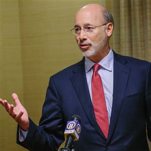 Gov. Tom Wolf said his plan to merge four state departments would streamline -- not cut -- services.