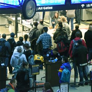 Travelers wait to go through  Security on the Landside Terminal of Pittsburgh International Airport.