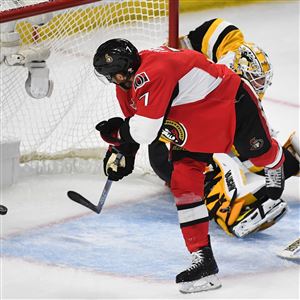 The Senators' Kyle Turris puts the puck past Penguins goalie Matt Murray on Wednesday at the Canadian Tire Center in Ottawa, Ontario.