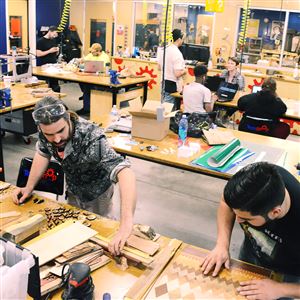 James Gyre, left, and David Villaverde of Naked Geometry make their wood products at TechShop in Bakery Square in June.