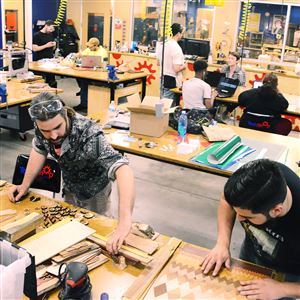 James Gyre, left, and David Villaverde of Naked Geometry make their wood products at TechShop in Bakery Square on Thursday.
