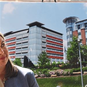 Valerie Blatt, vice president of global enablement for German Software Firm SAP, sits infront of the artist conception of  Continental Real Estate's project for a  seven-story office building which will serve as the headquarters for German software firm SAP on the North Shore of Pittsburgh.