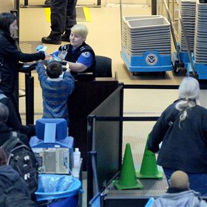 TSA security officers on duty checking passengers through security at Pittsburgh International Airport Thursday, Jan. 3, 2019. 