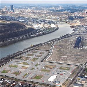 In this April 2018 photo, an aerial  view of Hazelwood Green along the Monongahela River with the city dkyline in the background. In the foreground is the Uber test track.