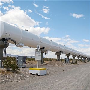 The test tube for the Virgin Hyperloop One pod stretches out along a wide gravel road in Apex, Nev.