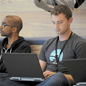 Interns Sai Yalamanchi, left,  of Carnegie Mellon University and Aaron Paczak of University of Pittsburgh, participate in an intern talk session at Uber ATG in the Strip District.