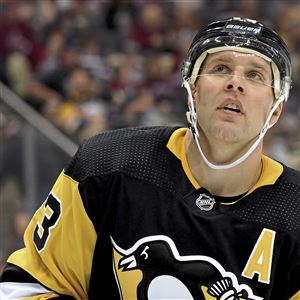 Penguins defenseman Jack Johnson readies for a faceoff Sept. 23 during a preseason game against the Red Wings.