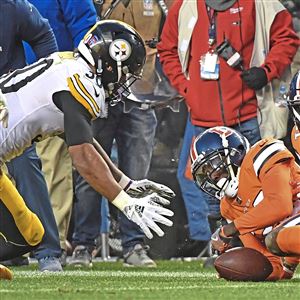 Denver, Colorado, USA. 25th Nov, 2018. Steelers WR JUJU SMITH-SCHUSTER,  center, gets hit after a catch during the 2nd. Half at Broncos Stadium at  Mile High Sunday afternoon. The Broncos beat the