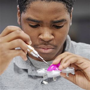 Marquis Green, 15, a student at Urban Pathways, disassembles his drone during Citizen Science Lab on Thursday, Jan. 17, 2019, at CoLab18 in the North Side. 