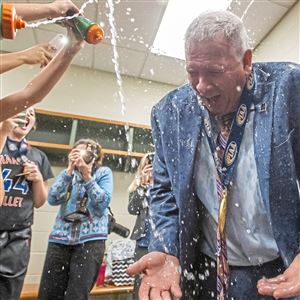 Chartiers Valley's Tim McConnell, shown here getting doused with water after the PIAA championship, is one of the Post-Gazette co-Coaches of the Year.