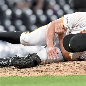 Pirates pitcher Nick Burdi goes down in pain after a pitch to Diamondbacks center fielder Jarrod Dyson in the eighth inning Monday, April 22, 2019, at PNC Park.