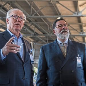Dan McCaffery, CEO of McCaffery Interests, talks with Mayor Bill Peduto about features of the redevelopment of the Produce Terminal building during a tour of the building, Tuesday, June 11, 2019, in the Strip District. 