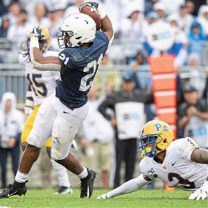 Penn State running back Noah Cain (21) rushes past Pitt defensive back Damar Hamlin (3) for a touchdown on Saturday, Sept. 14, 2019, at Beaver Stadium at University Park. Penn State beat Pitt, 17-10.