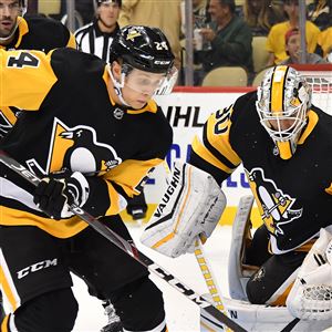 Dominik Kahun clears the puck in front of goaltender Matt Murray on Wednesday, Sept. 25, 2019, at PPG Paints Arena.