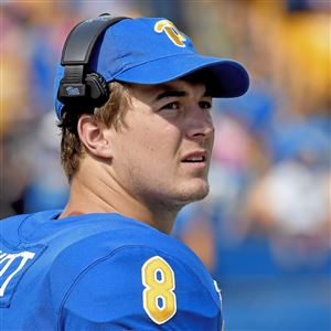 Pitt quarterback Kenny Pickett watches his team take on Delaware from the  sideline in the quarter of an NCAA college football game Saturday, Sept. 28  2019, at Heinz Field in Pittsburgh. (Matt