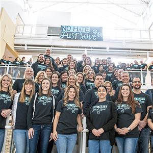 About 100 Canon-McMillan High School teachers wear T-shirts for a group photo to promote the school’s “No Place for Hate” initiative, which was started by English teacher Meg Pankiewicz and students after videos including racial slurs were circulated on social media.