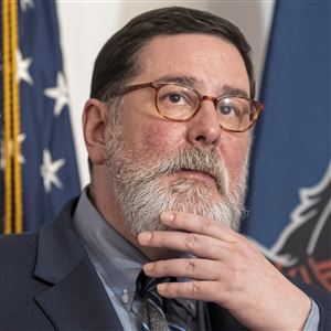 In this file photo, Pittsburgh Mayor Bill Peduto declares a state of emergency amid the COVID-19 pandemic on Friday, March 13, 2020, at the City-County Building, Downtown.