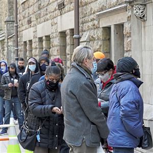 Voters wait in line to vote at Trinity Episcopal Cathedral Tuesday, Nov. 3, 2020, in Pittsburgh. 