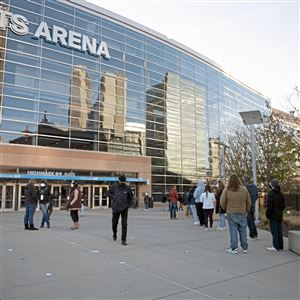   Dozens of people wait in line to vote Tuesday, Nov. 3, 2020, at the PPG Paints Arena, Downtown.                           