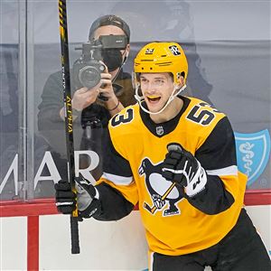 Pittsburgh Penguins' Radim Zohorna (67) celebrates with teammates on the  bench after scoring his first goal in the NHL during the first period of an  NHL hockey game against the Buffalo Sabres