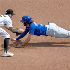 Scenes from Pirates-Cubs Opening Day: Hot start on a cold day in