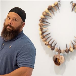 Sharif Bey with one of his radial necklaces at the Carnegie Museum of Art on June 16. 