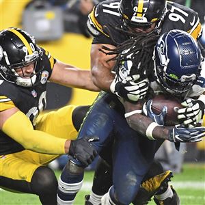 Pittsburgh Steelers strong safety Troy Polamalu (43) watches the replay on  his recovery of a Houston Texans fumble in the fourth quarter of the  Steelers 30-23 winat Heinz Field in Pittsburgh on October 20, 2014.  UPI/Archie Carpenter Stock Photo - Alamy