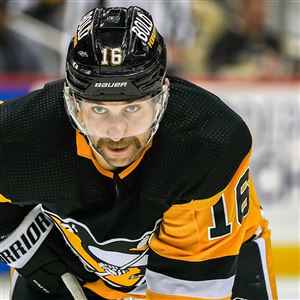 Pittsburgh Penguins' Jeff Carter (77) prepares for a face-off