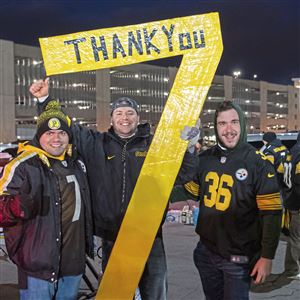 Pittsburgh Steelers quarterback Ben Roethlisberger (7) walks off the field  holding the jersey of linebacker Ryan Shazier after beating the Baltimore  Ravens 39-38 to clinch the AFC North Championship in an NFL