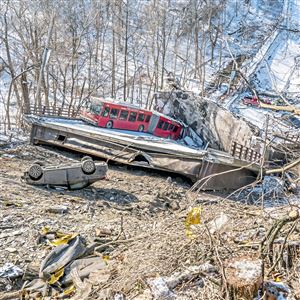 Vehicles and a Port Authority bus are seen in the wreckage of the collapsed Fern Hollow Bridge, Saturday, Jan. 29, 2022, in Frick Park.