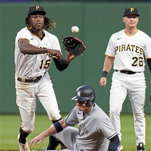 Pittsburgh, United States. 06th July, 2022. Pittsburgh Pirates shortstop Oneil  Cruz (15) step away from the sliding New York Yankees center fielder Aaron  Judge (99) and throws to first for the double