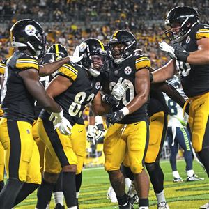 Pittsburgh Steelers wide receiver Gunner Olszewski (89) catches a pass in  front of cornerback Madre Harper (38)) during an NFL football team's  training camp workout in Latrobe, Pa., Tuesday, Aug. 1, 2023. (