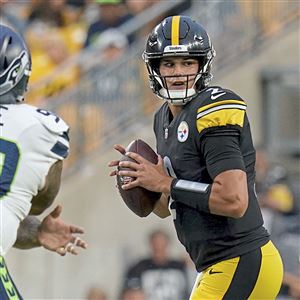 Pittsburgh Steelers quarterback Kenny Pickett rolls out against the Tampa  Bay Buccaneers during an NFL football game at Acrisure Stadium, Sunday,  Oct. 16, 2022 in Pittsburgh. (Winslow Townson/AP Images for Panini Stock