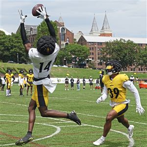 Pittsburgh Steelers wide receiver Gunner Olszewski (89) catches a pass in  front of cornerback Madre Harper (38)) during an NFL football team's  training camp workout in Latrobe, Pa., Tuesday, Aug. 1, 2023. (