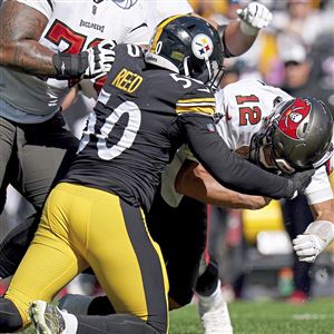 Pittsburgh Steelers quarterback Kenny Pickett rolls out against the Tampa  Bay Buccaneers during an NFL football game at Acrisure Stadium, Sunday, Oct.  16, 2022 in Pittsburgh. (Winslow Townson/AP Images for Panini Stock