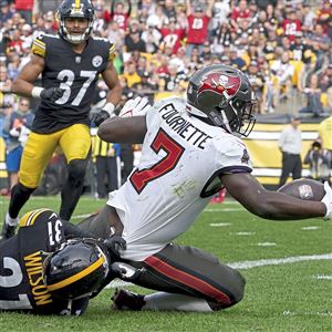 Pittsburgh Steelers quarterback Kenny Pickett rolls out against the Tampa  Bay Buccaneers during an NFL football game at Acrisure Stadium, Sunday,  Oct. 16, 2022 in Pittsburgh. (Winslow Townson/AP Images for Panini Stock