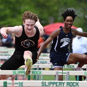 Quaker Valley Davin Gartley jumps over the hurdles in the 110-meter hurdles in WPIAL Class 2A  Boys Track and Field Championships at Slippery Rock University on Wednesday May 15, 2024. 