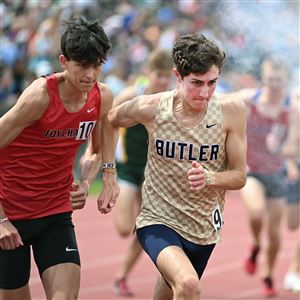 Butler Drew Griffth, right, gets a jump over Fox Chapel's Rowan Gwin in the 1600-meter run at the WPIAL track championships. Griffith made league history when he won the 1,600 and 3,200 in consecutive years.