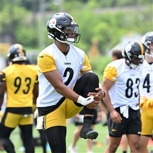 Steelers quarterback Justin Fields stretches during OTAs practice at the UPMC Rooney Sports Complex on the South Side Tuesday, May 21, 2024.
