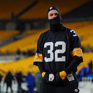 Pittsburgh Steelers Santonio Holmes raises the Lamar Hunt Trophy over his  head celebrating the 23-14 win of the AFC Championship game over the  Baltimore Raven at Heinz Field in Pittsburgh on January