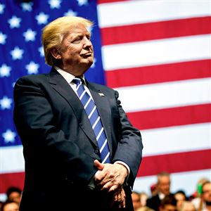 President-elect Donald Trump looks on during a rally Friday at the DeltaPlex Arena in Grand Rapids, Mich.