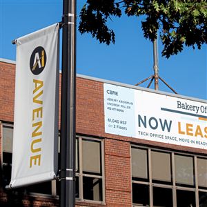 New AI Avenue signs are seen along Penn Avenue in Bakery Square on Thursday, Oct. 10. A newly formed "AI strike team" is seeking to make Pittsburgh a top tier hub for AI work, with 100,000 tech jobs by 2028.