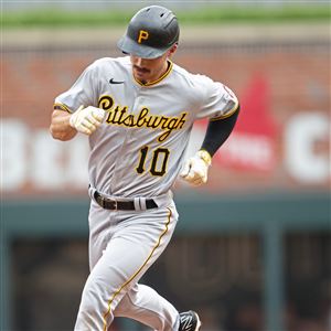 Pittsburgh Pirates' Cal Mitchell, right, is greeted by Jack