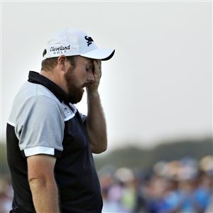 Shane Lowry, of the Republic of Ireland, wipes his face after finishing the final round of the U.S. Open golf championship at Oakmont Country Club on Sunday, June 19, 2016, in Oakmont, Pa. Dustin Johnson won.